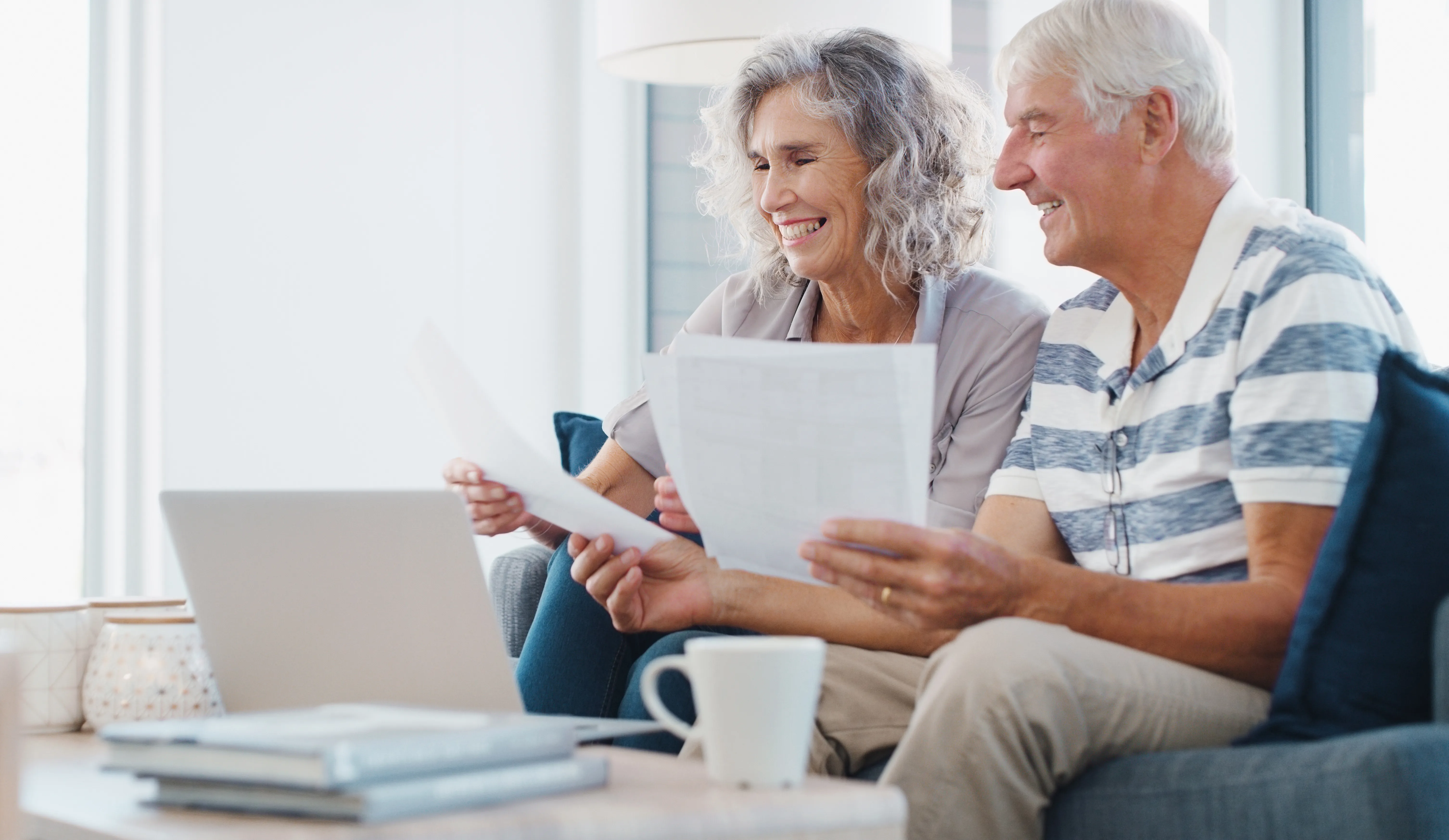Couple reviewing property and account documents with an attorney