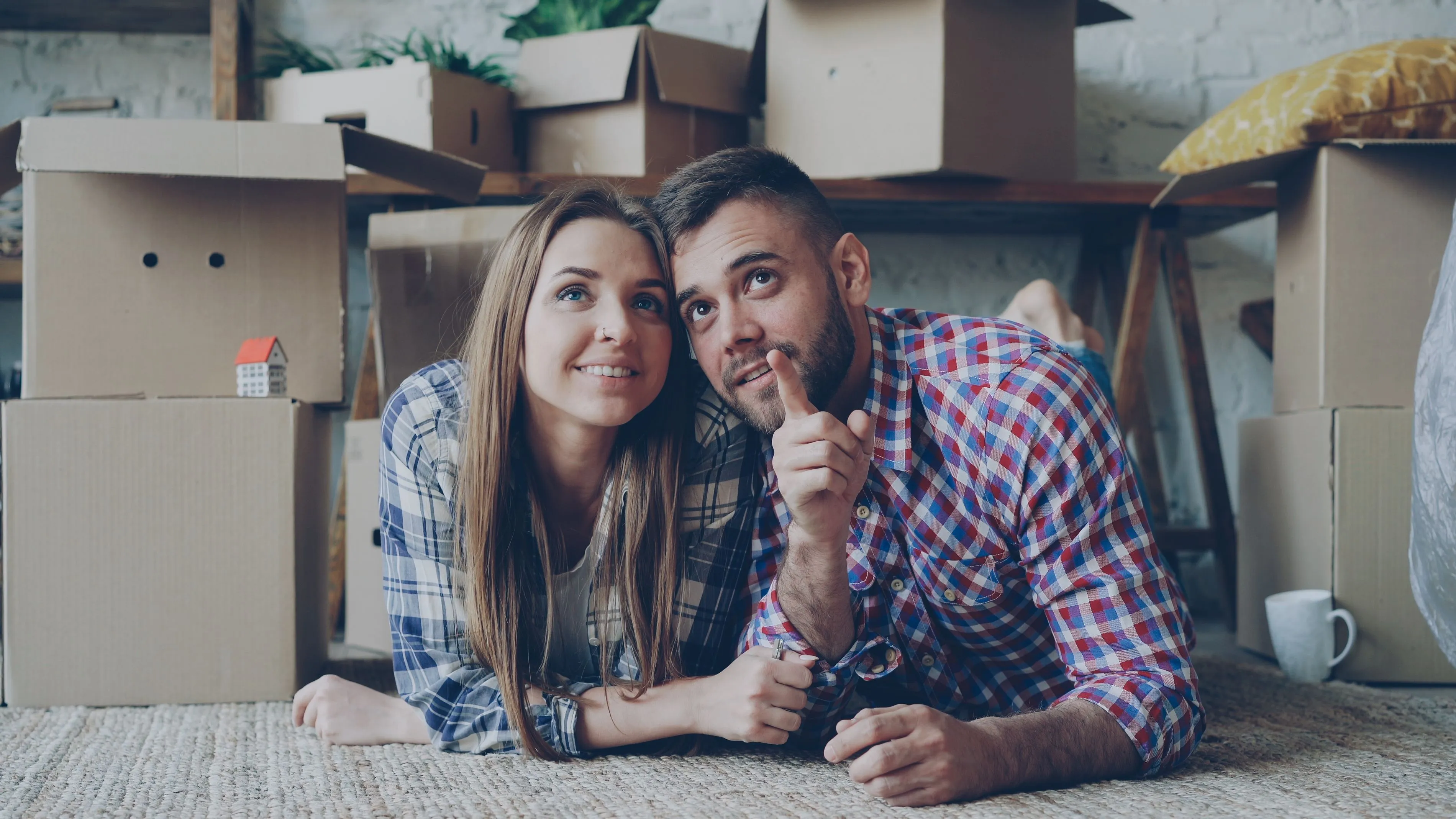 Young Couple in their Living Room Dreaming